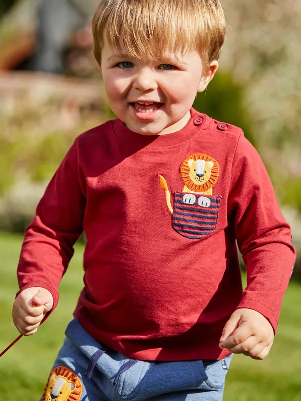 
            
                Load image into Gallery viewer, Lion Applique’ Pocket Burgundy Long Sleeve Top - Select Size
            
        